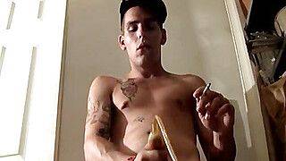 Chain smoker toying his dick with a pump and cumming - gayxo.com